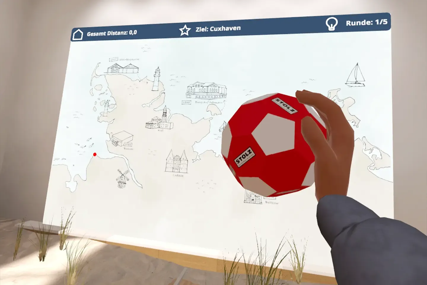 Virtual hand holds a red and white STOLZ ball in front of a drawn map of northern Germany with the target Cuxhaven